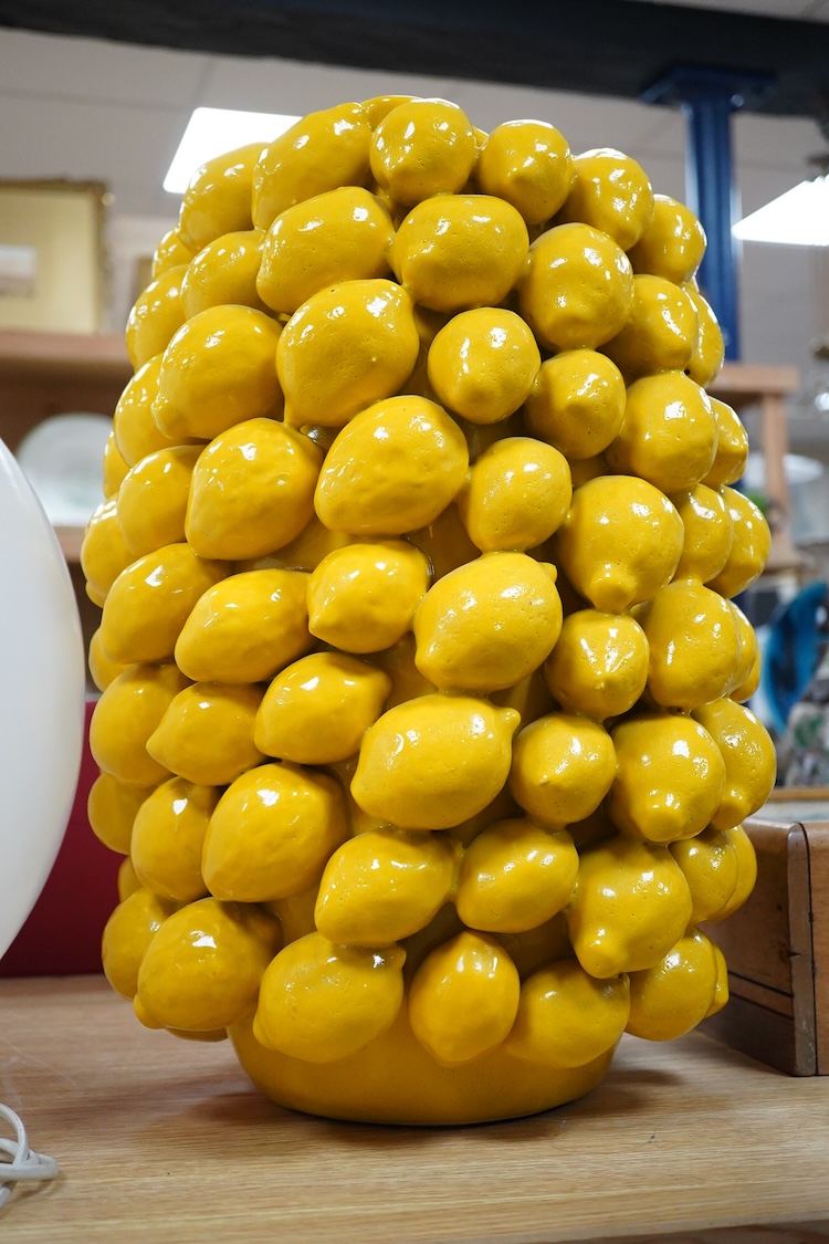 A large yellow glazed ceramic ‘lemons’ vase, 45cm